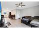 Open concept living room with kitchen views and hardwood floors at 1000 Lake Of The Woods Blvd # A204, Fern Park, FL 32730