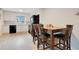 Modern kitchen with white cabinets, black appliances, and a breakfast bar at 1000 Lake Of The Woods Blvd # A204, Fern Park, FL 32730