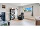 Cozy bedroom with a large window, hardwood floors, and built-in shelving at 1000 Lake Of The Woods Blvd # A204, Fern Park, FL 32730