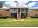 Condo building exterior with stairs and screened porch at 1000 Lake Of The Woods Blvd # A204, Fern Park, FL 32730