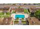 Community pool with surrounding patio and landscaping at 1000 Lake Of The Woods Blvd # A204, Fern Park, FL 32730