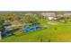 Community playground with shaded areas and picnic tables at 3070 Silver Fin Way, Kissimmee, FL 34746