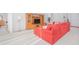 Comfortable living room with red sectional sofa and wood entertainment center at 3070 Silver Fin Way, Kissimmee, FL 34746