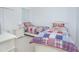 Cozy bedroom with twin beds, nightstand, and ample closet space at 3070 Silver Fin Way, Kissimmee, FL 34746