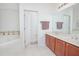 Bathroom boasts double sinks, a large soaking tub, and a separate shower at 3070 Silver Fin Way, Kissimmee, FL 34746