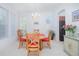 Charming dining room with wooden table and chairs at 3070 Silver Fin Way, Kissimmee, FL 34746