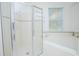 Bright bathroom with a walk-in shower and a corner soaking tub at 3070 Silver Fin Way, Kissimmee, FL 34746