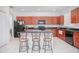 Modern kitchen with granite countertops and wooden cabinets at 3070 Silver Fin Way, Kissimmee, FL 34746