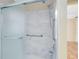 Bathroom with marble shower and grab bars at 4621 N Pine Hills Rd # 113, Orlando, FL 32808