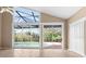 Spacious Gathering room with pool view and sliding glass doors at 2128 Lake Crescent Ct, Windermere, FL 34786