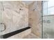 Large walk-in shower with neutral tile and built-in bench at 2128 Lake Crescent Ct, Windermere, FL 34786