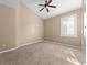 Spacious bedroom with ceiling fan and large window at 2128 Lake Crescent Ct, Windermere, FL 34786
