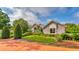 House exterior with well-manicured landscaping at 2128 Lake Crescent Ct, Windermere, FL 34786