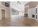 Open living room with a fireplace, tile floors, and pool view at 2128 Lake Crescent Ct, Windermere, FL 34786