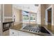 Island kitchen with granite countertops and stainless steel appliances at 2128 Lake Crescent Ct, Windermere, FL 34786