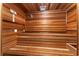 Private home sauna with wood walls and built in bench at 2128 Lake Crescent Ct, Windermere, FL 34786