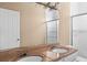 Bathroom with double vanity and large mirror at 2128 Lake Crescent Ct, Windermere, FL 34786