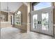 Elegant entryway with stained-glass doors and tile flooring at 2128 Lake Crescent Ct, Windermere, FL 34786