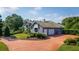 Exterior view of house featuring a two-car garage and manicured lawn at 2128 Lake Crescent Ct, Windermere, FL 34786