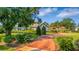 Landscaped front yard and driveway, showcasing a beautiful home at 2128 Lake Crescent Ct, Windermere, FL 34786