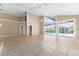 Bright living room featuring high ceilings and pool access at 2128 Lake Crescent Ct, Windermere, FL 34786