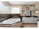 Bathroom with a large corner bathtub and double sinks at 2128 Lake Crescent Ct, Windermere, FL 34786