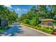 Windermere Club entrance with lush landscaping at 2128 Lake Crescent Ct, Windermere, FL 34786