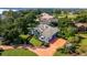 Aerial view of single-Gathering home with large yard and circular driveway at 2128 Lake Crescent Ct, Windermere, FL 34786