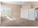 Bedroom with window, closet, and neutral decor at 2128 Lake Crescent Ct, Windermere, FL 34786