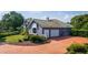 Home's exterior, highlighting the two-car garage and landscaping at 2128 Lake Crescent Ct, Windermere, FL 34786