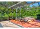 Covered lanai with seating and a hot tub at 2128 Lake Crescent Ct, Windermere, FL 34786