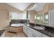 Elegant bathroom featuring a corner jacuzzi tub and double vanity at 2128 Lake Crescent Ct, Windermere, FL 34786