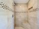 Spa-like shower with tiled walls and built-in seat at 10324 Pleasant View Dr, Leesburg, FL 34788