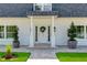 Inviting front entrance with white door and potted plants at 5274 Pinto Way, Orlando, FL 32810