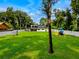 Expansive backyard with playset, large lawn, and home at 5274 Pinto Way, Orlando, FL 32810