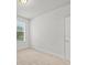 Bright bedroom with neutral walls and carpeting at 8362 Bella Tierra Ct, Davenport, FL 33896