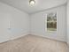 Well-lit bedroom featuring neutral walls and carpet at 8362 Bella Tierra Ct, Davenport, FL 33896