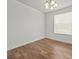 Spacious bedroom with hardwood floors and large window at 8362 Bella Tierra Ct, Davenport, FL 33896