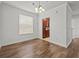 Dining room with hardwood floors and kitchen access at 8362 Bella Tierra Ct, Davenport, FL 33896