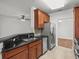 Modern kitchen with dark countertops and stainless steel appliances at 8362 Bella Tierra Ct, Davenport, FL 33896