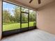 Screened porch with view of grassy backyard at 8362 Bella Tierra Ct, Davenport, FL 33896