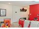 Dining area features a glass table and red chairs at 205 Bella Verano Way, Davenport, FL 33897
