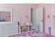Bedroom with white dresser and desk at 205 Bella Verano Way, Davenport, FL 33897