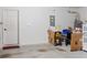 Garage with interior door and storage items at 205 Bella Verano Way, Davenport, FL 33897