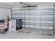 Garage with large door and some storage items at 205 Bella Verano Way, Davenport, FL 33897