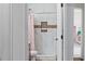 Bathroom with shower, toilet, and marble tile at 205 Bella Verano Way, Davenport, FL 33897