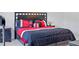 Bedroom with king-size bed, red and black bedding, and nightstand at 205 Bella Verano Way, Davenport, FL 33897