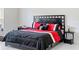 Spacious bedroom with a king-size bed and black dresser at 205 Bella Verano Way, Davenport, FL 33897