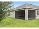 Side view of screened porch and house exterior at 205 Bella Verano Way, Davenport, FL 33897