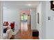 Bright hallway with hardwood floors, leading to living room at 205 Bella Verano Way, Davenport, FL 33897
